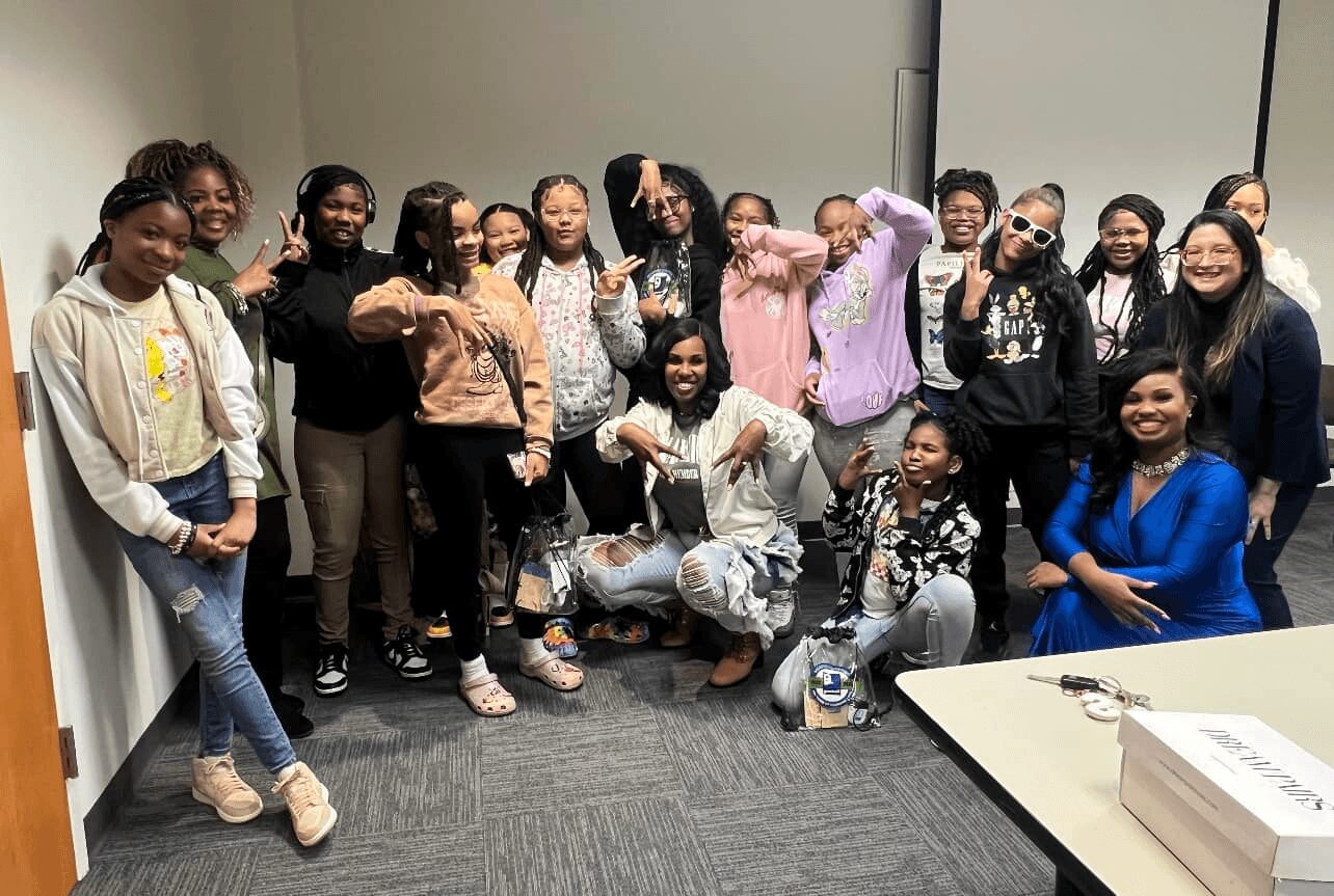 Shamica with a group of young women after a workshop